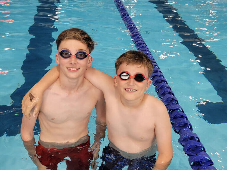 Sportsrec Swimmingpool Twoboyssmilinggoggles