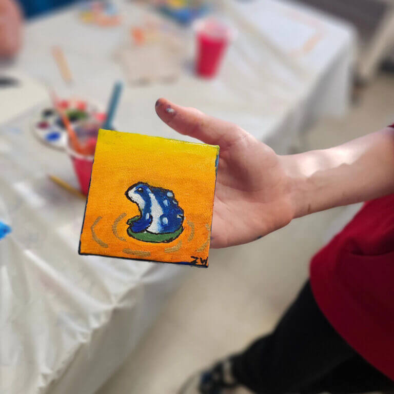 Child's art class, painted frog