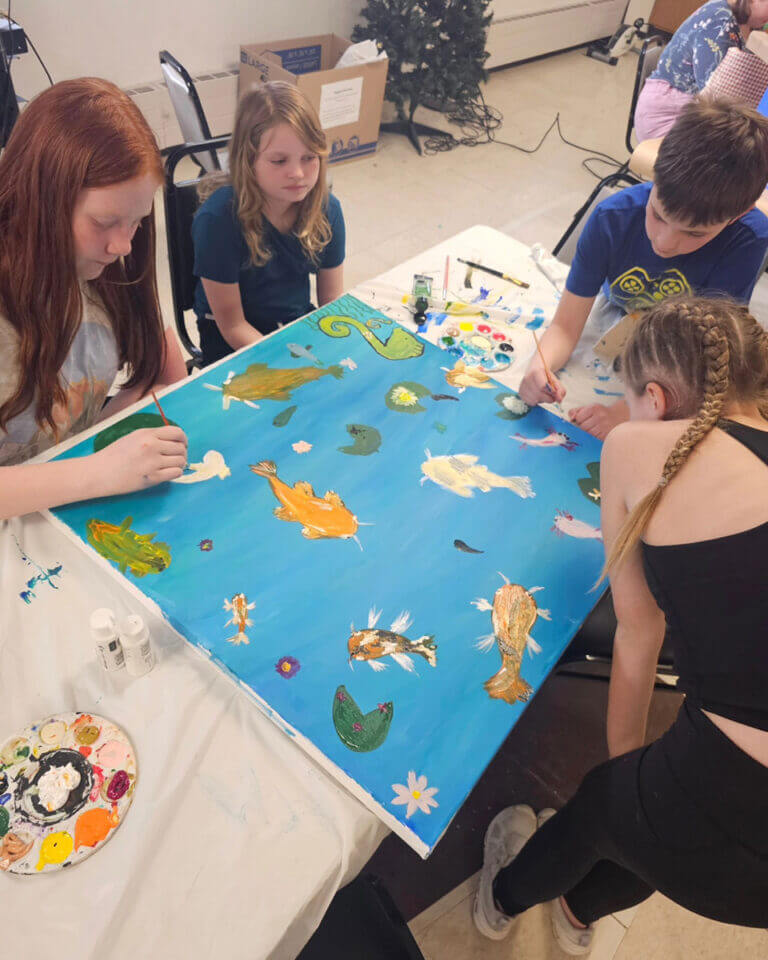 Kids' art class painting fish